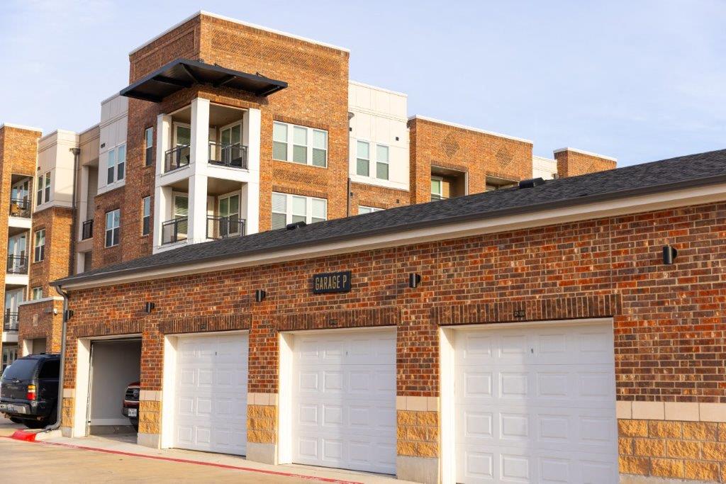 Detached garages with white doors at Heritage Towers