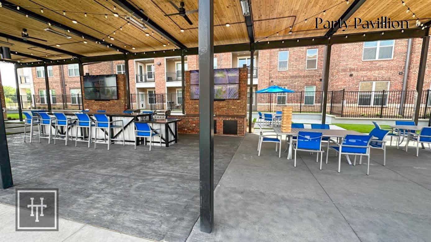 A patio area with tables and chairs