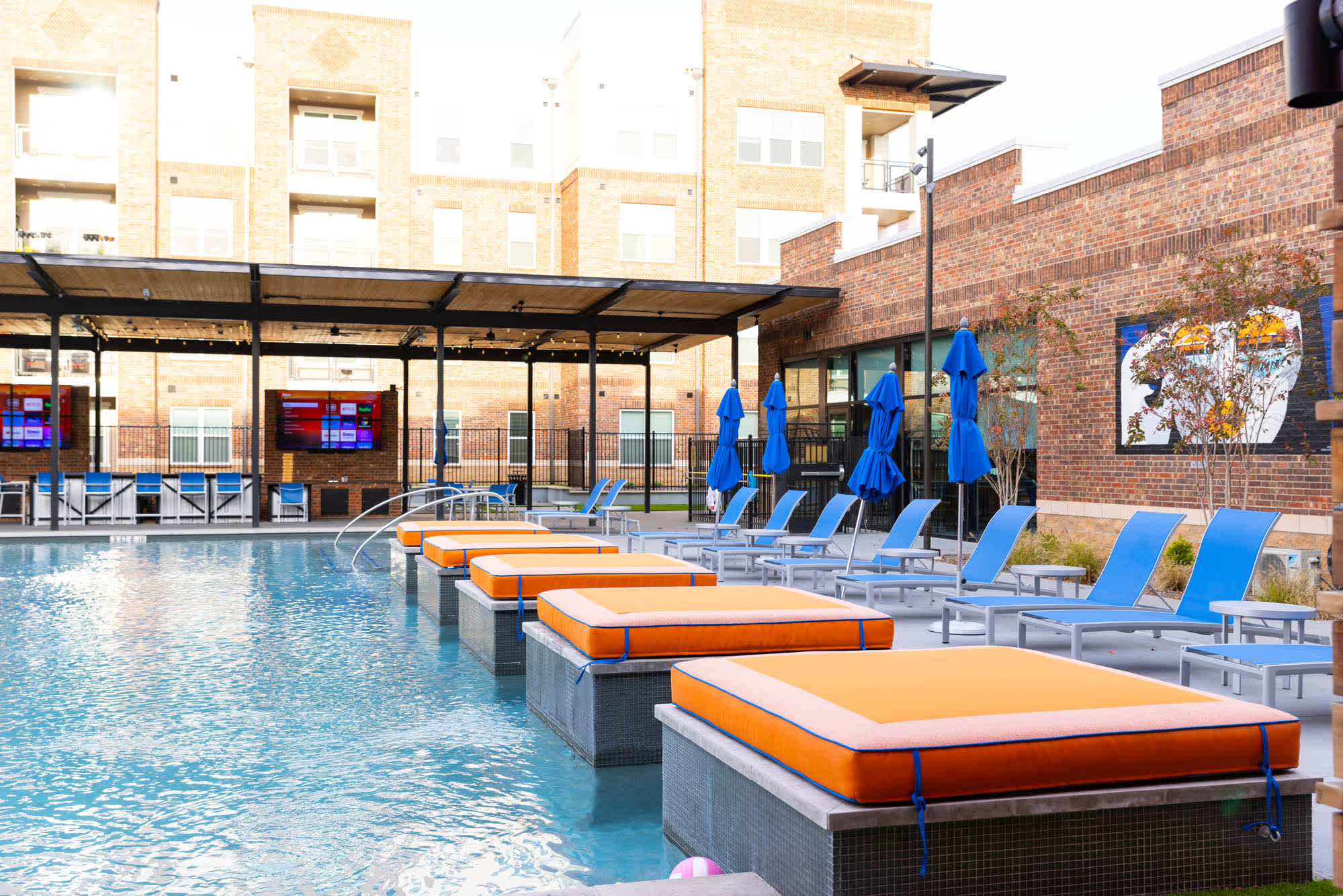 The resort style pool with lounge chairs